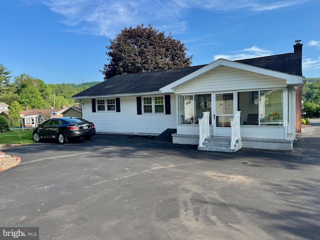 1954 High Park Mnr, Pottsville, PA 17901 - view of front of property with a sunroom and a chimney