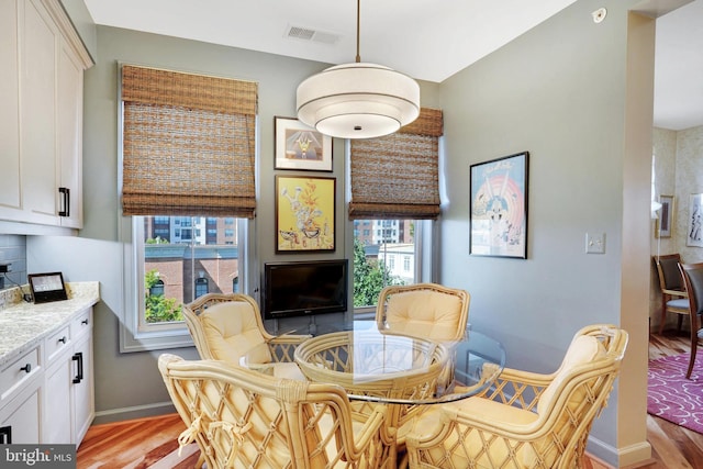 440 Belmont Bay Dr Unit 406, Woodbridge, VA 22191 - dining room with light wood-style floors and baseboards