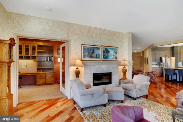 440 Belmont Bay Dr Unit 406, Woodbridge, VA 22191 - living room with light wood-style floors and a tile fireplace
