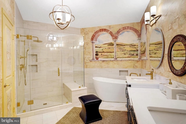 440 Belmont Bay Dr Unit 406, Woodbridge, VA 22191 - bathroom featuring a stall shower, tile walls, a soaking tub, double vanity, and a chandelier