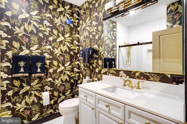 440 Belmont Bay Dr Unit 406, Woodbridge, VA 22191 - bathroom featuring wallpapered walls, toilet, vanity, and tiled shower