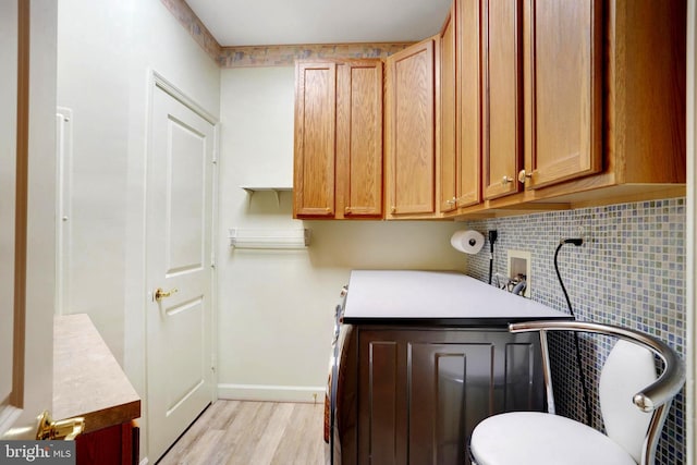 440 Belmont Bay Dr Unit 406, Woodbridge, VA 22191 - laundry area with washer hookup, cabinet space, light wood-style floors, and baseboards