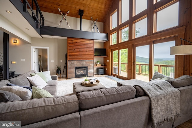 311 Summit Woods Dr, Mc Henry, MD 21541 - living area with a tiled fireplace, high vaulted ceiling, wood ceiling, recessed lighting, and wood finished floors