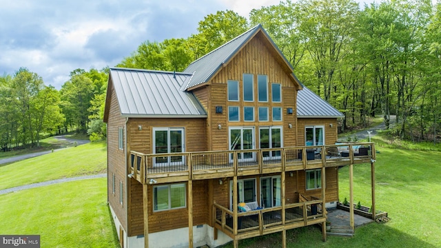 311 Summit Woods Dr, Mc Henry, MD 21541 - back of house featuring a wooden deck, a lawn, a standing seam roof, and metal roof