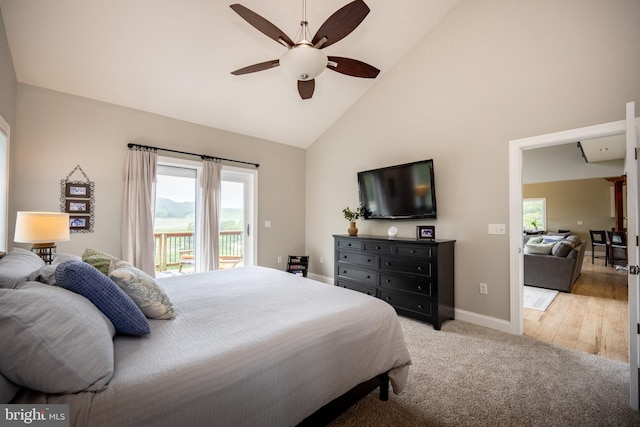 311 Summit Woods Dr, Mc Henry, MD 21541 - bedroom with access to exterior, high vaulted ceiling, multiple windows, baseboards, and light carpet