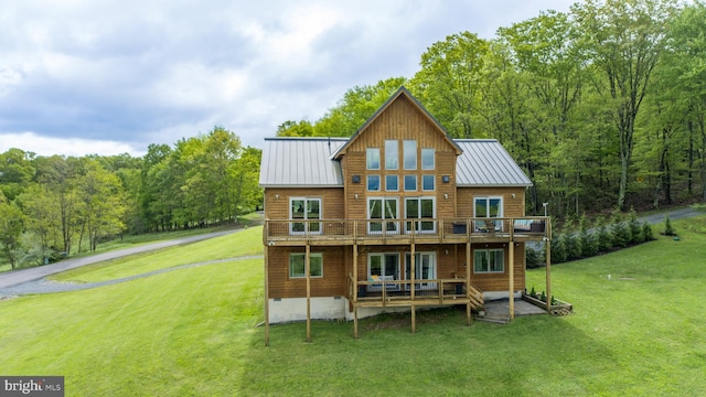 311 Summit Woods Dr, Mc Henry, MD 21541 - back of house with a wooden deck, a lawn, and a standing seam roof