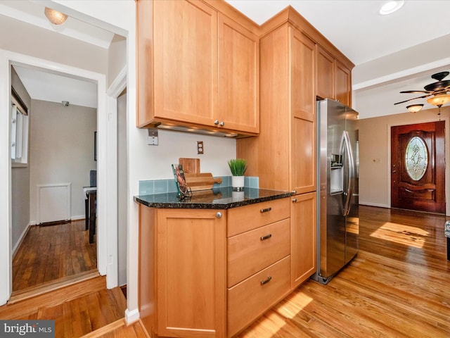 2820 Harris Ave, Silver Spring, MD 20902 - kitchen with stainless steel refrigerator with ice dispenser, light wood-style floors, a ceiling fan, dark stone counters, and baseboards