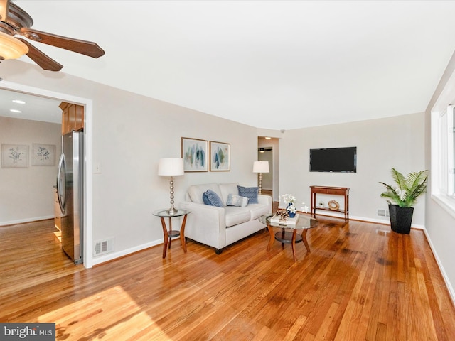 2820 Harris Ave, Silver Spring, MD 20902 - living area with light wood finished floors, ceiling fan, and baseboards