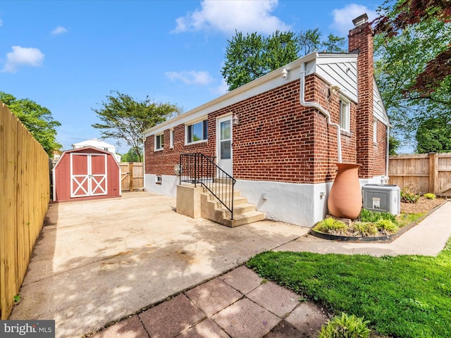 2820 Harris Ave, Silver Spring, MD 20902 - view of front facade with brick siding, a chimney, and a fenced backyard