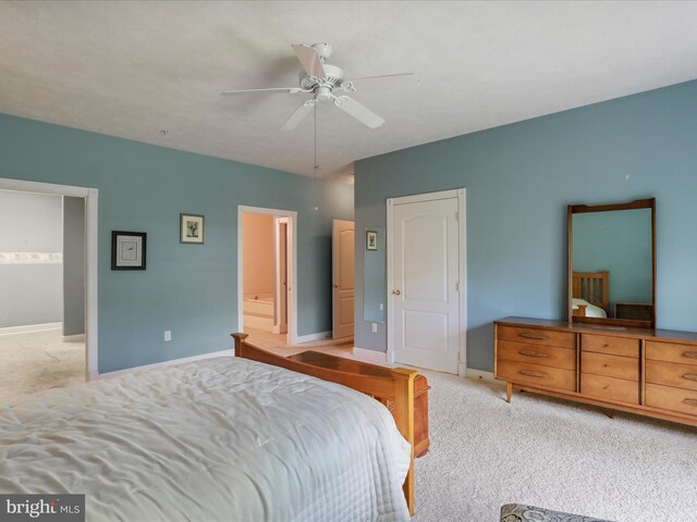 12953 Little Hayden Cir, Hagerstown, MD 21742 - bedroom featuring light carpet, baseboards, ceiling fan, and ensuite bathroom