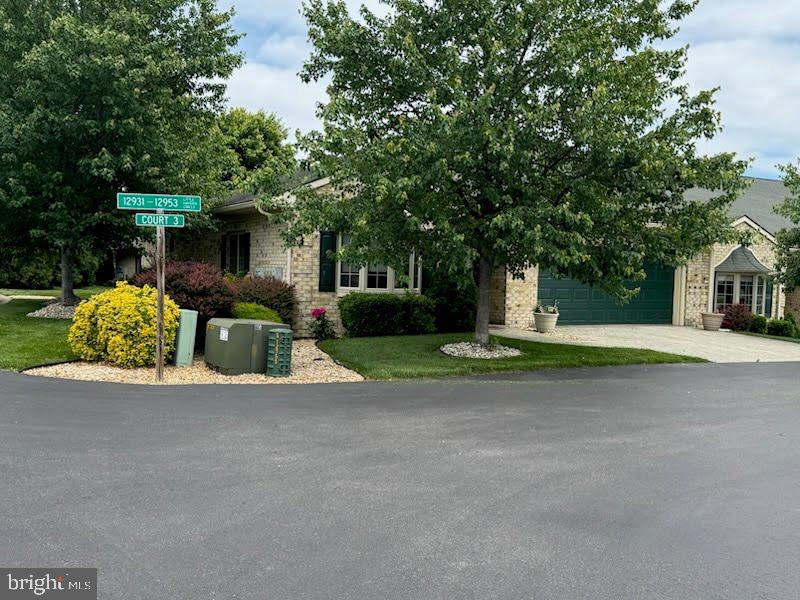 12953 Little Hayden Cir, Hagerstown, MD 21742 - obstructed view of property featuring driveway and an attached garage