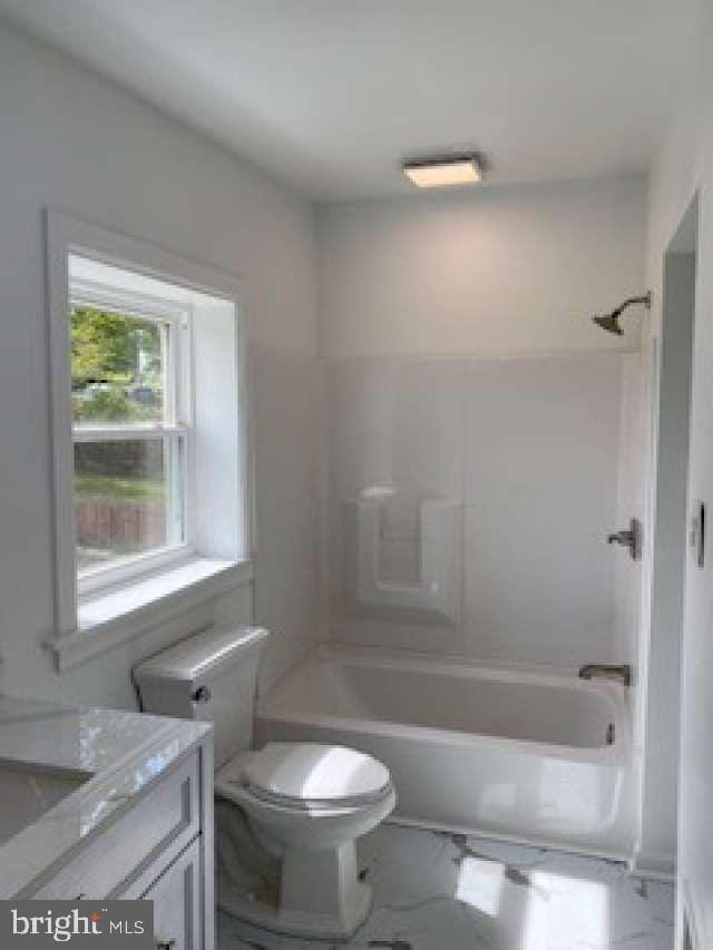 70 Chestnut St, Mohnton, PA 19540 - bathroom featuring  shower combination, toilet, and vanity