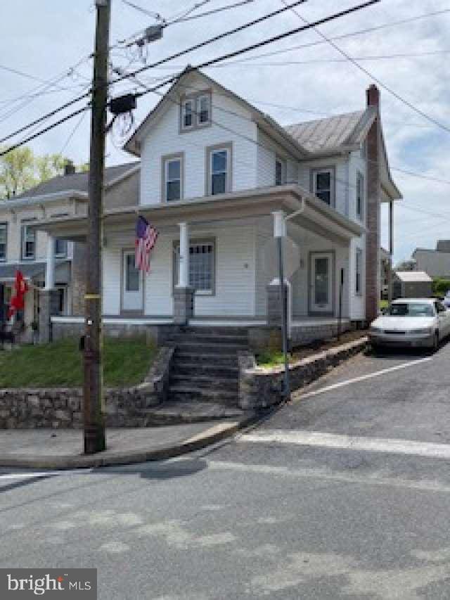 70 Chestnut St, Mohnton, PA 19540 - view of front of property featuring a chimney and covered porch