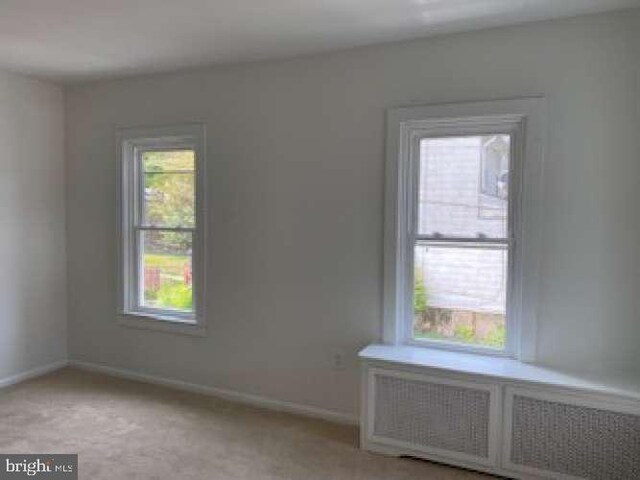 70 Chestnut St, Mohnton, PA 19540 - spare room featuring radiator, baseboards, and light colored carpet
