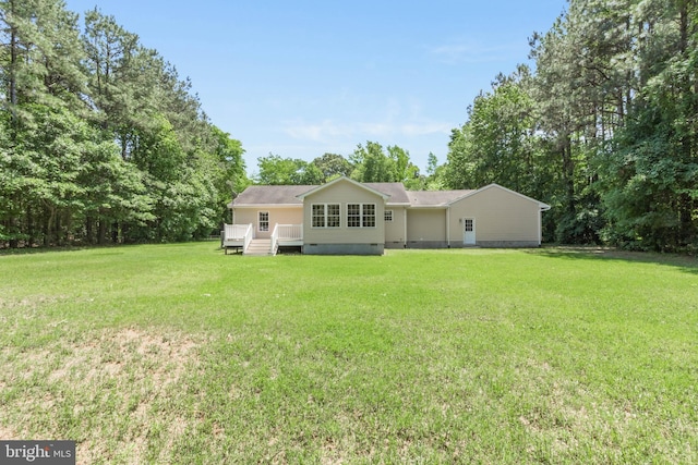 14323 Shiloh Church Rd, Laurel, DE 19956 - rear view of property featuring crawl space, a yard, a wooden deck, and view of wooded area