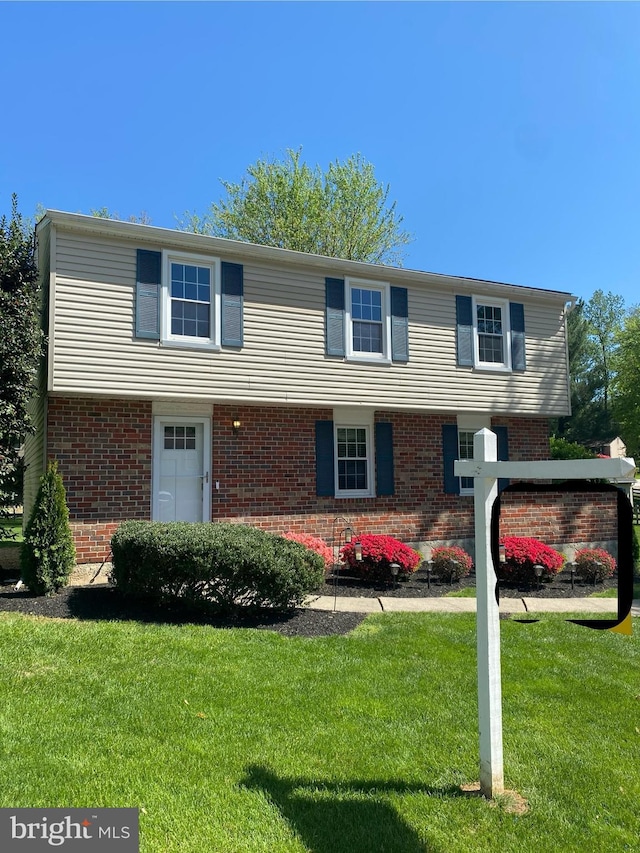 9313 Waltham Woods Rd, Baltimore, MD 21234 - colonial home featuring a front lawn and brick siding