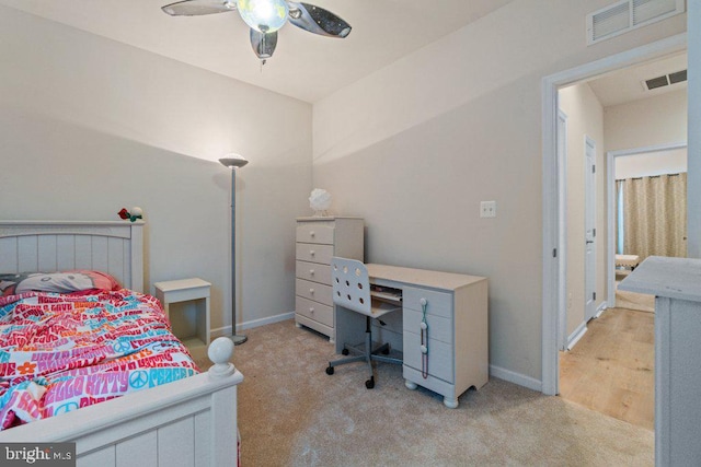 carpeted bedroom with a ceiling fan and baseboards