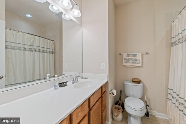 bathroom with toilet, vanity, tile patterned flooring, baseboards, and a shower with shower curtain