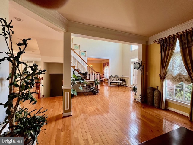 4718 Village Dr, Fairfax, VA 22030 - workout room with crown molding, wood-type flooring, ornate columns, and baseboards