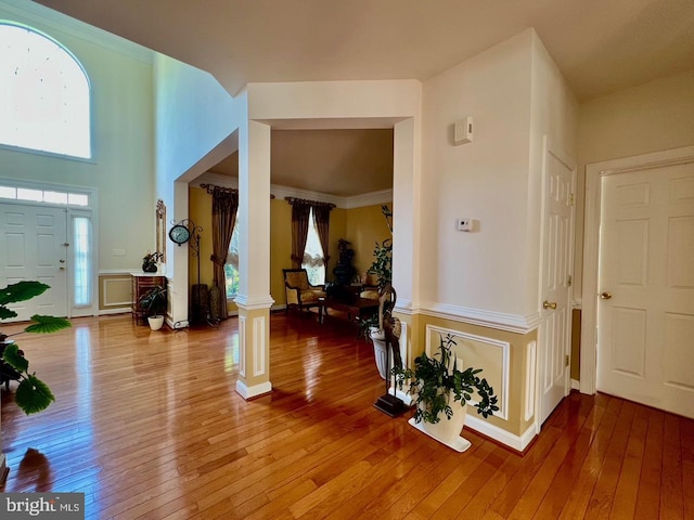 4718 Village Dr, Fairfax, VA 22030 - entryway with light wood-type flooring, plenty of natural light, and ornate columns