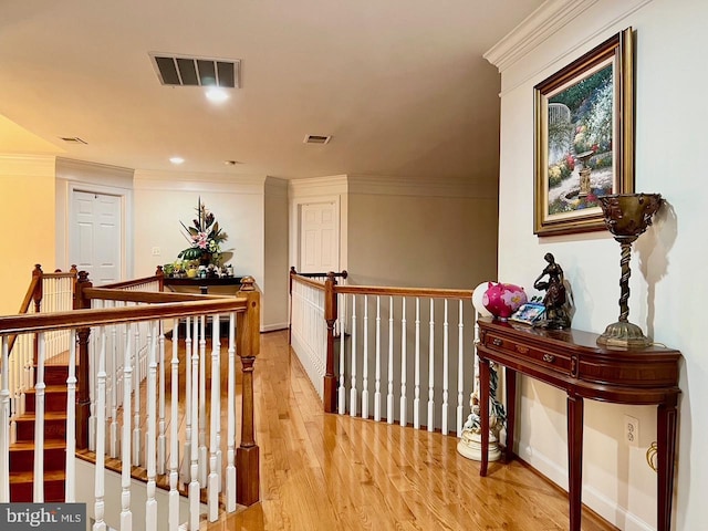 4718 Village Dr, Fairfax, VA 22030 - hall featuring wood finished floors, ornamental molding, an upstairs landing, and baseboards