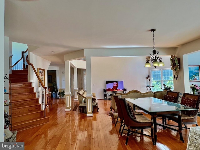 4718 Village Dr, Fairfax, VA 22030 - dining space with light wood-style floors and stairs