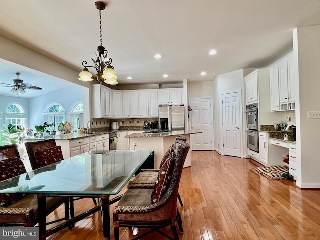 4718 Village Dr, Fairfax, VA 22030 - dining space with recessed lighting, light wood-style floors, and a ceiling fan
