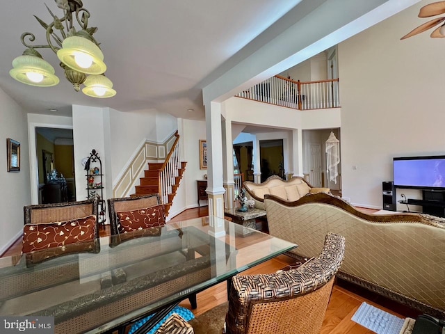 4718 Village Dr, Fairfax, VA 22030 - dining area featuring stairs, a ceiling fan, and wood finished floors