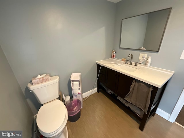12808 New Row Rd, Mount Savage, MD 21545 - bathroom featuring baseboards, vanity, toilet, and wood finished floors