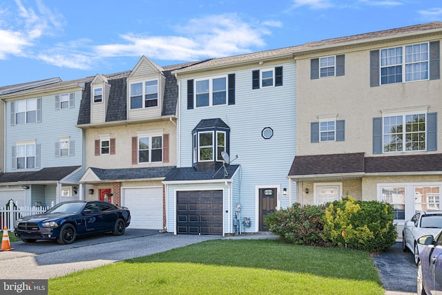1065 Old Forge Rd, New Castle, DE 19720 - townhome / multi-family property featuring driveway, an attached garage, and a front yard