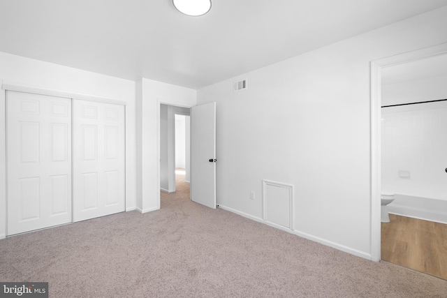 1065 Old Forge Rd, New Castle, DE 19720 - unfurnished bedroom featuring carpet flooring, a closet, baseboards, and connected bathroom