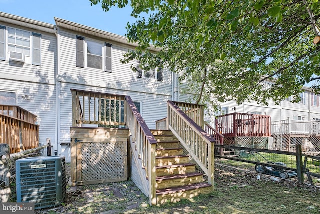 1065 Old Forge Rd, New Castle, DE 19720 - back of property with stairway, central air condition unit, and a wooden deck