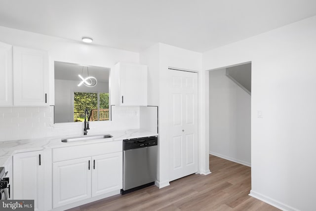 1065 Old Forge Rd, New Castle, DE 19720 - kitchen with dishwasher, a sink, tasteful backsplash, light wood-style flooring, and white cabinetry