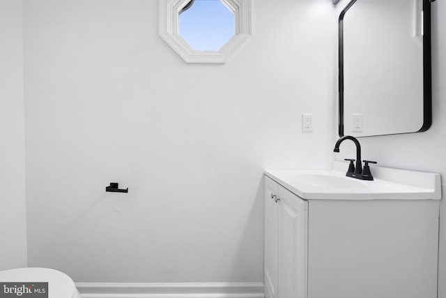 1065 Old Forge Rd, New Castle, DE 19720 - half bathroom with vanity, toilet, and baseboards