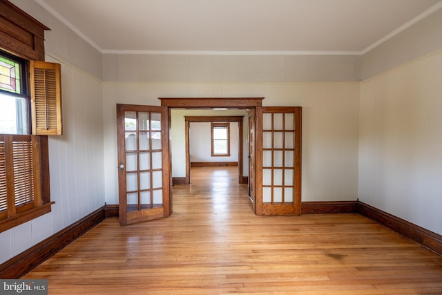 89 Main St N, Kilmarnock, VA 22482 - unfurnished room featuring french doors, light wood-style floors, crown molding, and baseboards
