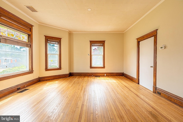 89 Main St N, Kilmarnock, VA 22482 - spare room featuring crown molding, light wood-type flooring, and baseboards