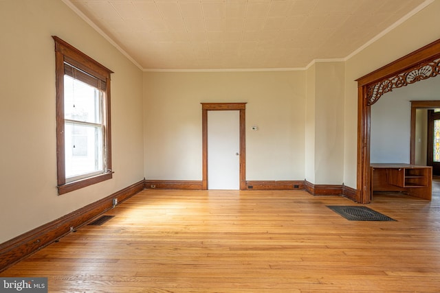 89 Main St N, Kilmarnock, VA 22482 - empty room featuring crown molding, plenty of natural light, hardwood / wood-style flooring, and baseboards