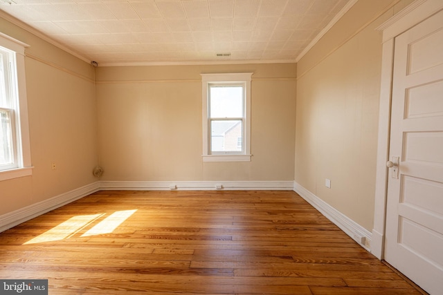 89 Main St N, Kilmarnock, VA 22482 - empty room with ornamental molding, light wood-type flooring, and baseboards