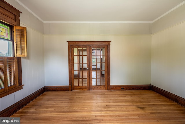 89 Main St N, Kilmarnock, VA 22482 - spare room featuring light wood-style floors, baseboards, crown molding, and plenty of natural light