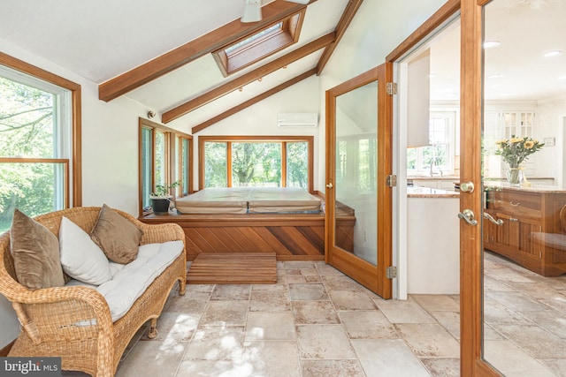 3048 Aquetong Rd, New Hope, PA 18938 - bathroom featuring stone tile floors, a skylight, vanity, a bath, and recessed lighting