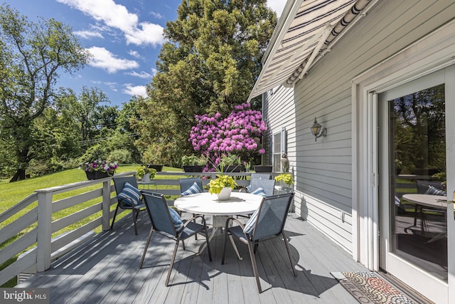 3048 Aquetong Rd, New Hope, PA 18938 - wooden deck featuring outdoor dining area, a lawn, and view of scattered trees