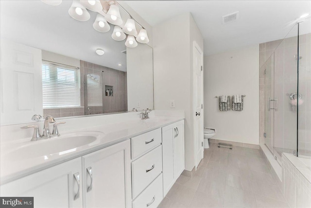 304 Redbud Ln, Kennett Square, PA 19348 - bathroom featuring toilet, a stall shower, double vanity, and tile patterned flooring