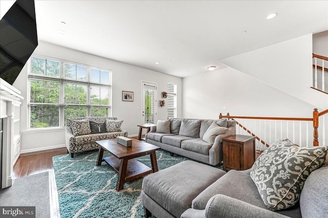 304 Redbud Ln, Kennett Square, PA 19348 - living room featuring wood finished floors, recessed lighting, baseboards, a glass covered fireplace, and stairway