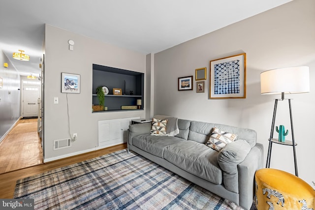 747 Mchenry St, Baltimore, MD 21230 - living room with wood finished floors and baseboards