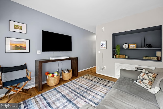 747 Mchenry St, Baltimore, MD 21230 - living room featuring wood finished floors and baseboards