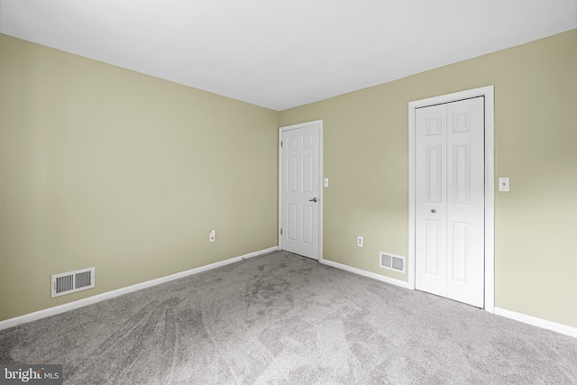 747 Mchenry St, Baltimore, MD 21230 - unfurnished bedroom with baseboards, carpet floors, and a closet
