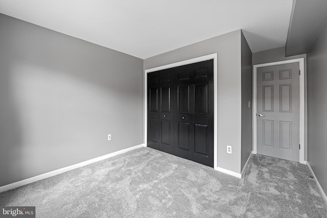 747 Mchenry St, Baltimore, MD 21230 - unfurnished bedroom with carpet floors, baseboards, and a closet