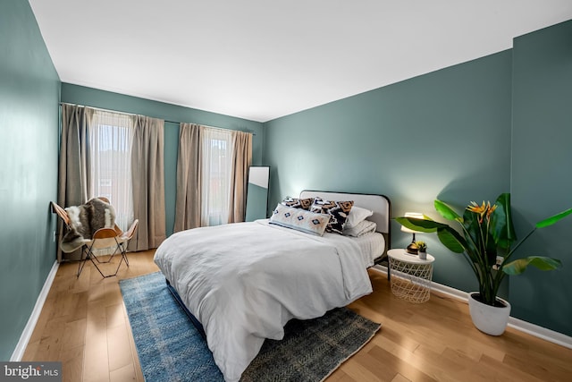 747 Mchenry St, Baltimore, MD 21230 - bedroom featuring baseboards and wood finished floors