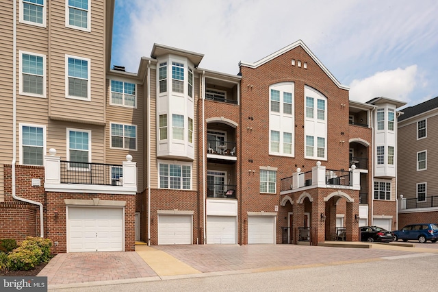 7305 Maplecrest Rd Unit 407, Elkridge, MD 21075 - view of property featuring a garage and driveway