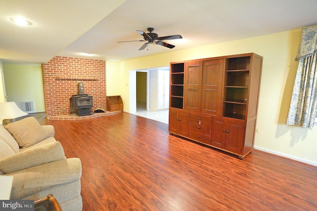 301 Country Club Trl, Fairfield, PA 17320 - living area with a wood stove, wood finished floors, ceiling fan, and baseboards